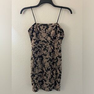 Forever 21 Beautiful black and gold/tan mini dress with small slit size M